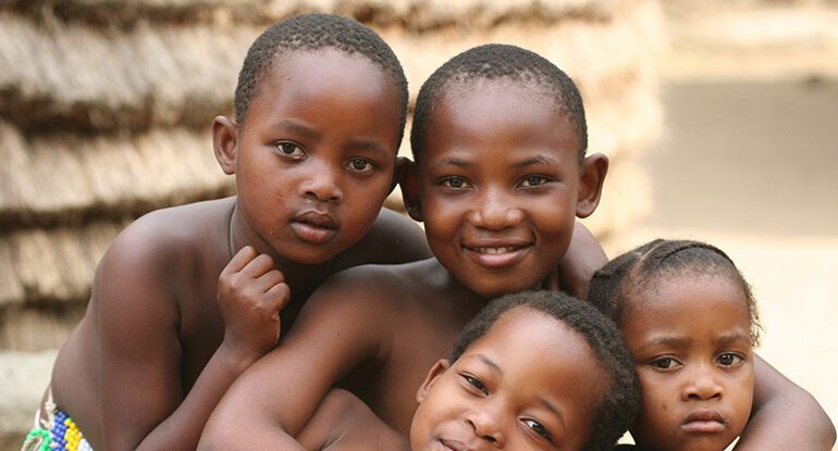 A group of young boys posing for the camera.