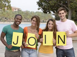 A group of people holding up signs that say " join ".